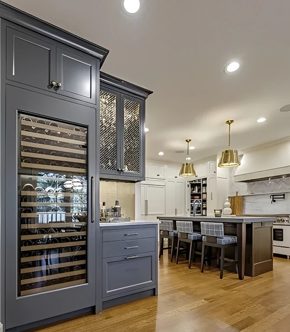 Modern kitchen with wine fridge and island.