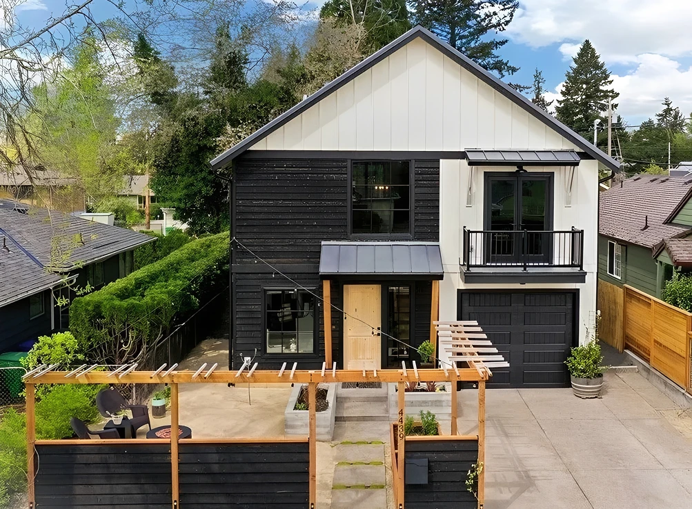 Modern two-story house with patio area.