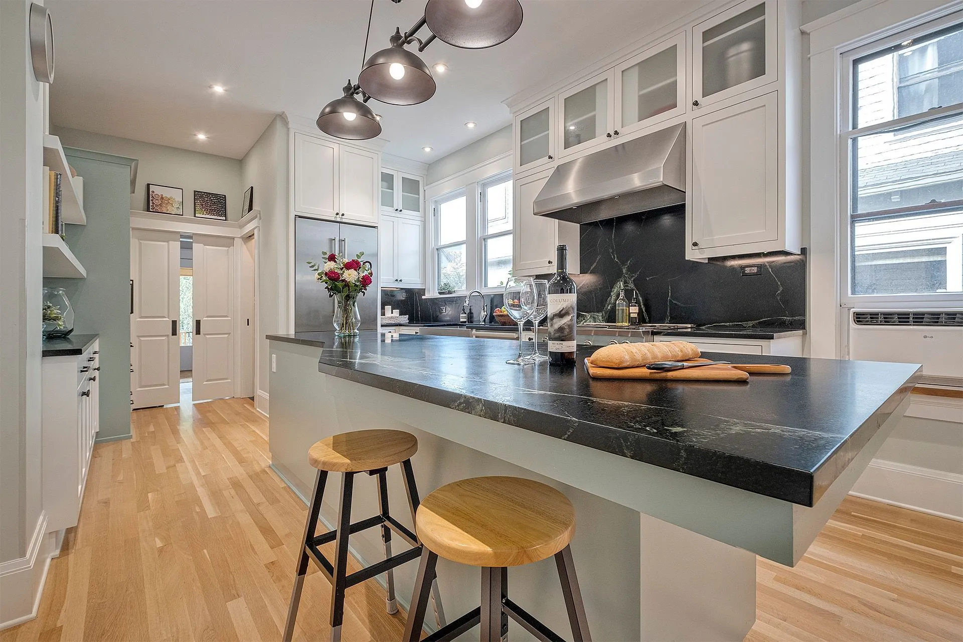 Elegant kitchen featuring wooden stools