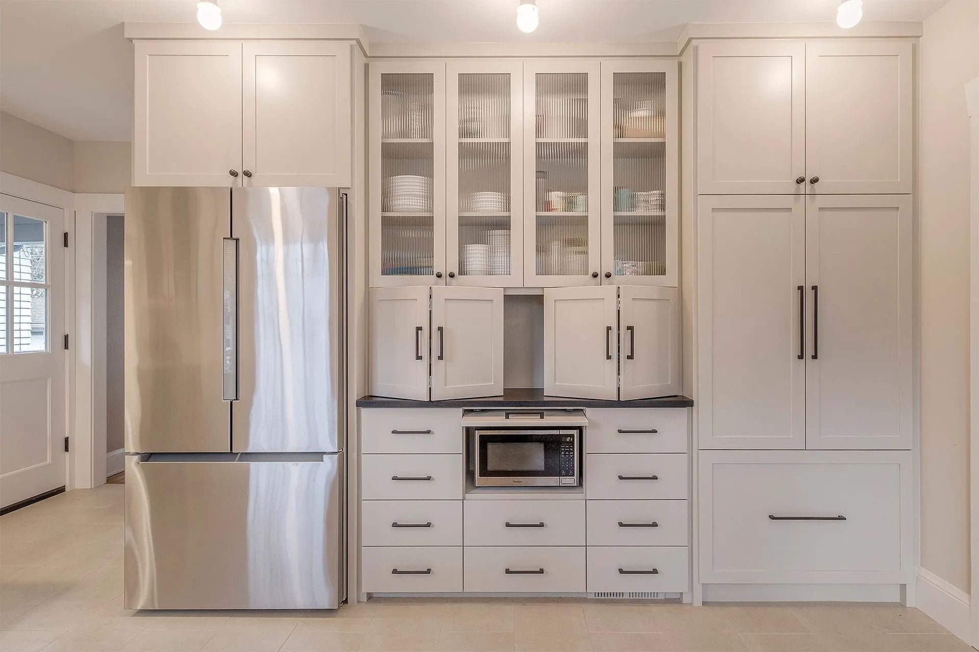Contemporary kitchen layout with storage units