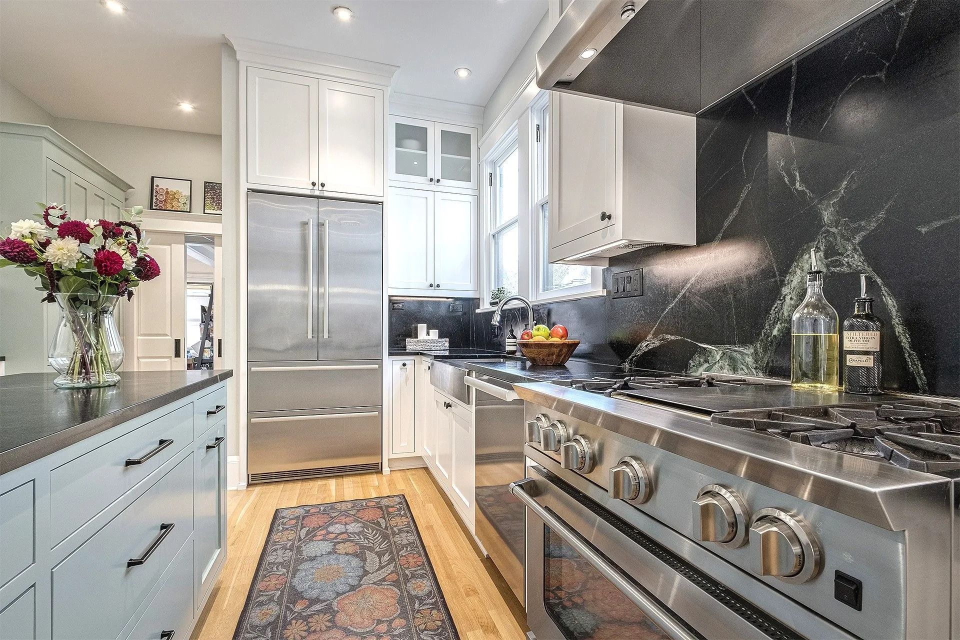 Elegant kitchen with black marble backsplash