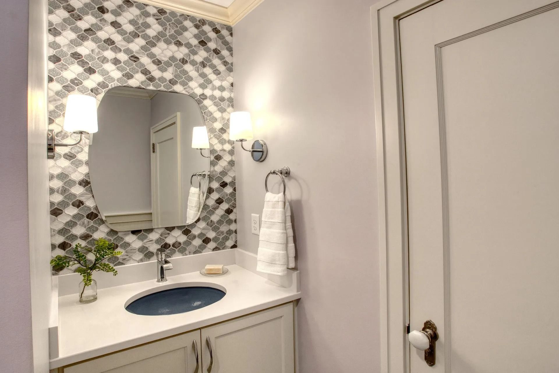 Elegant vanity with mosaic backsplash