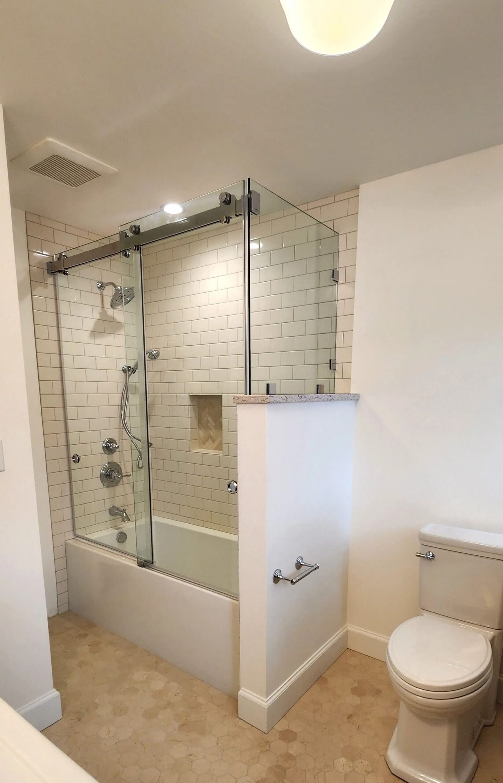 White bathroom with tiled shower area