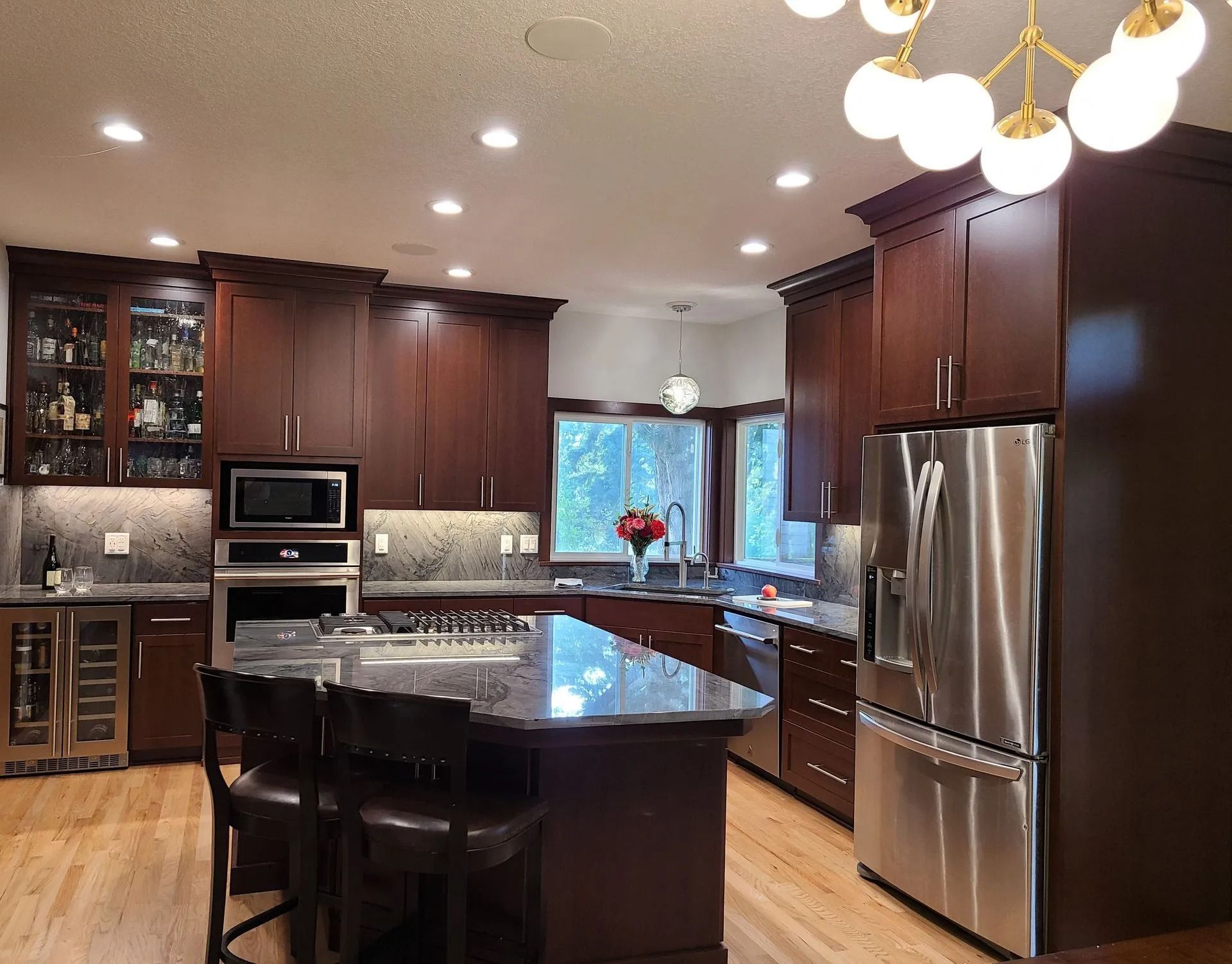 Spacious kitchen featuring island and barstools