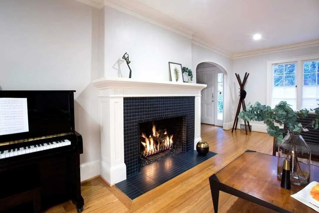 Cozy living room with lit fireplace