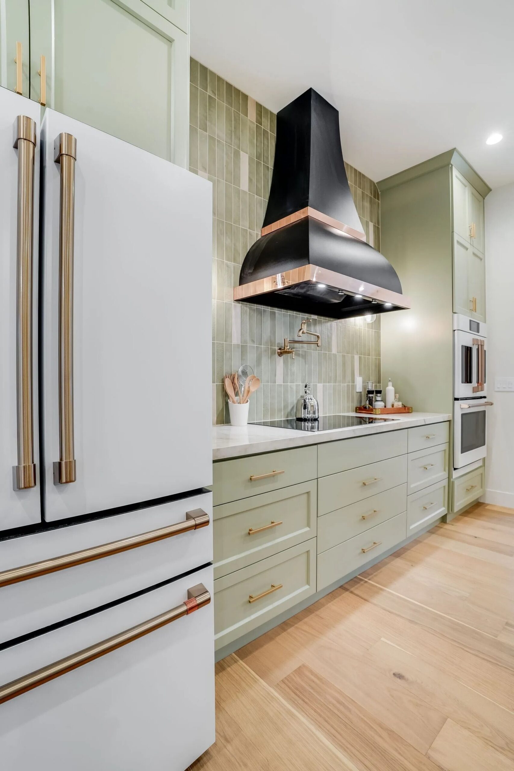 Stylish kitchen with black range hood