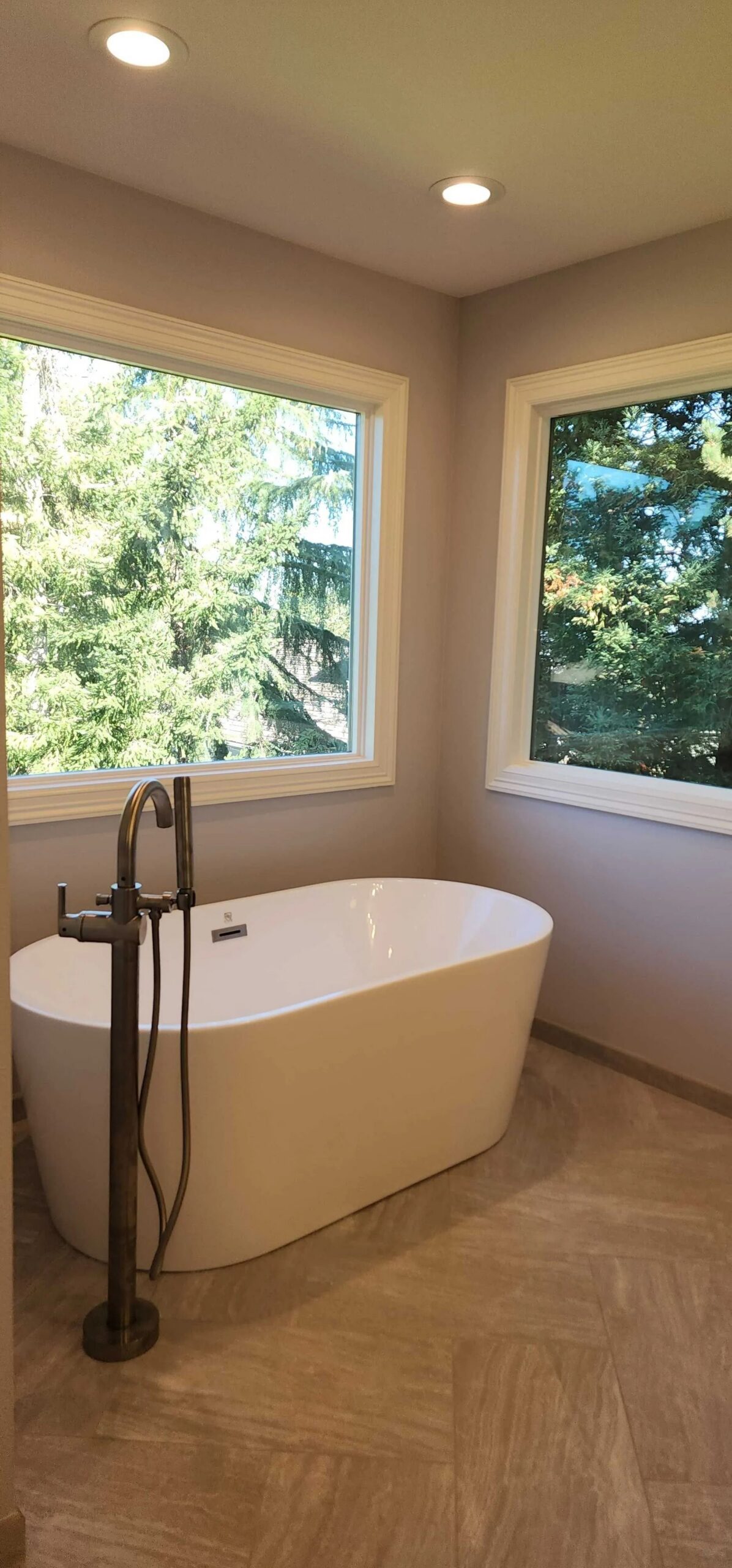 Freestanding bathtub with forest view