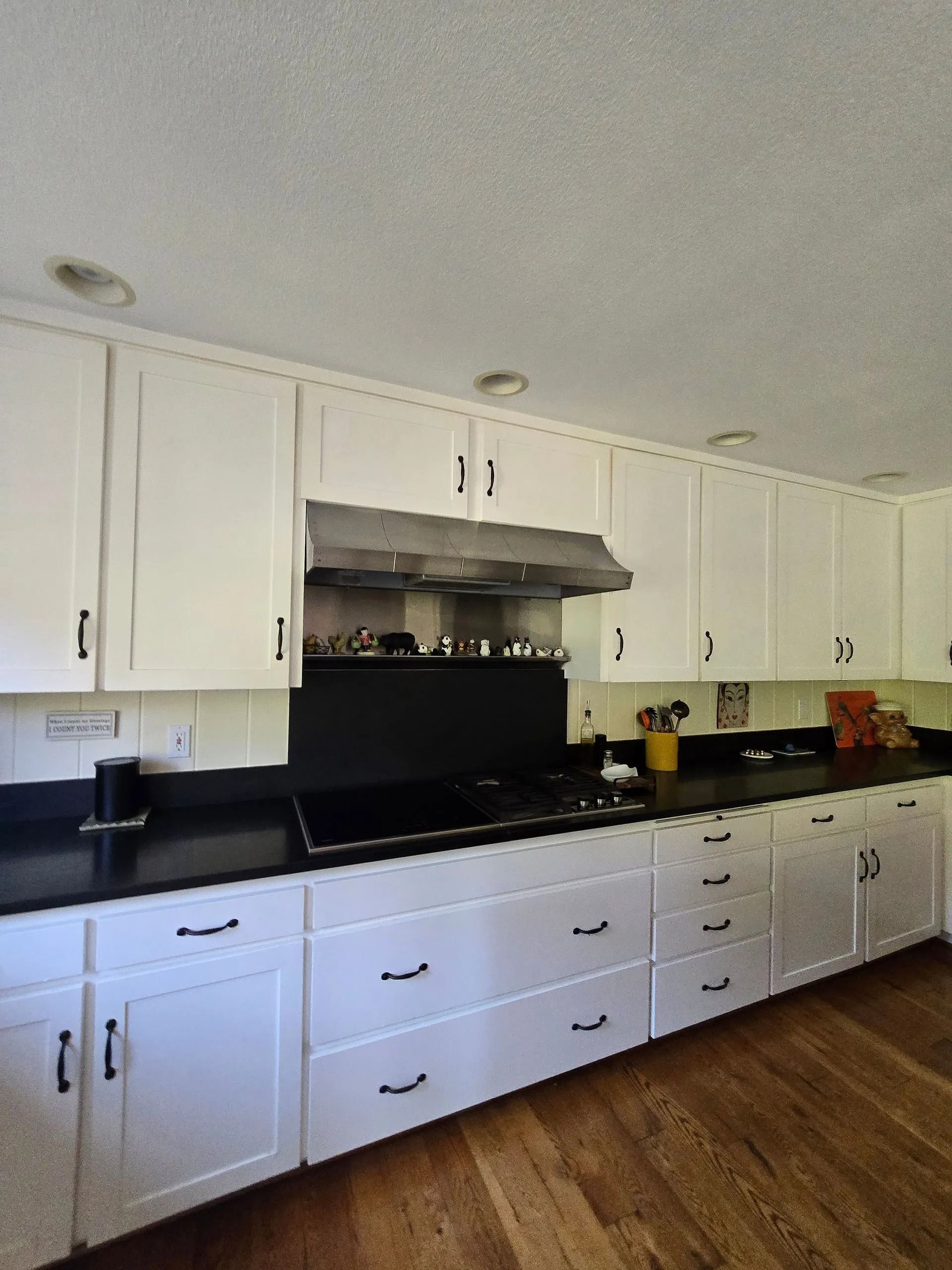 Modern kitchen with stainless steel range hood