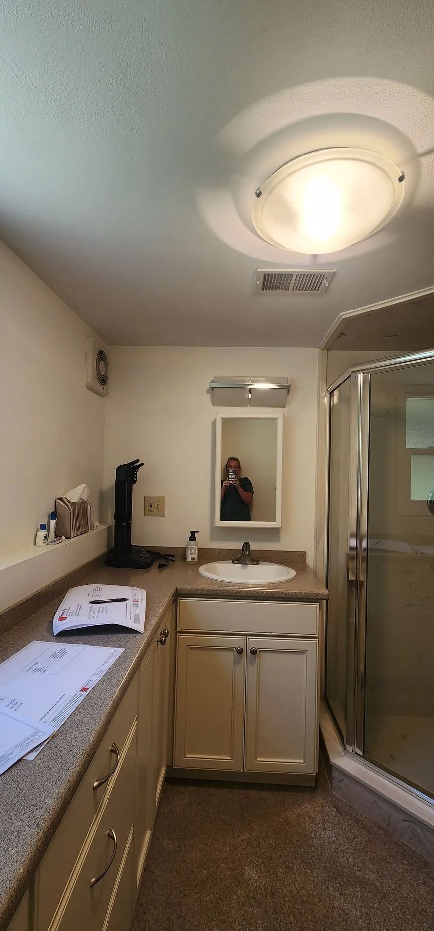 Small bathroom with counter and mirror