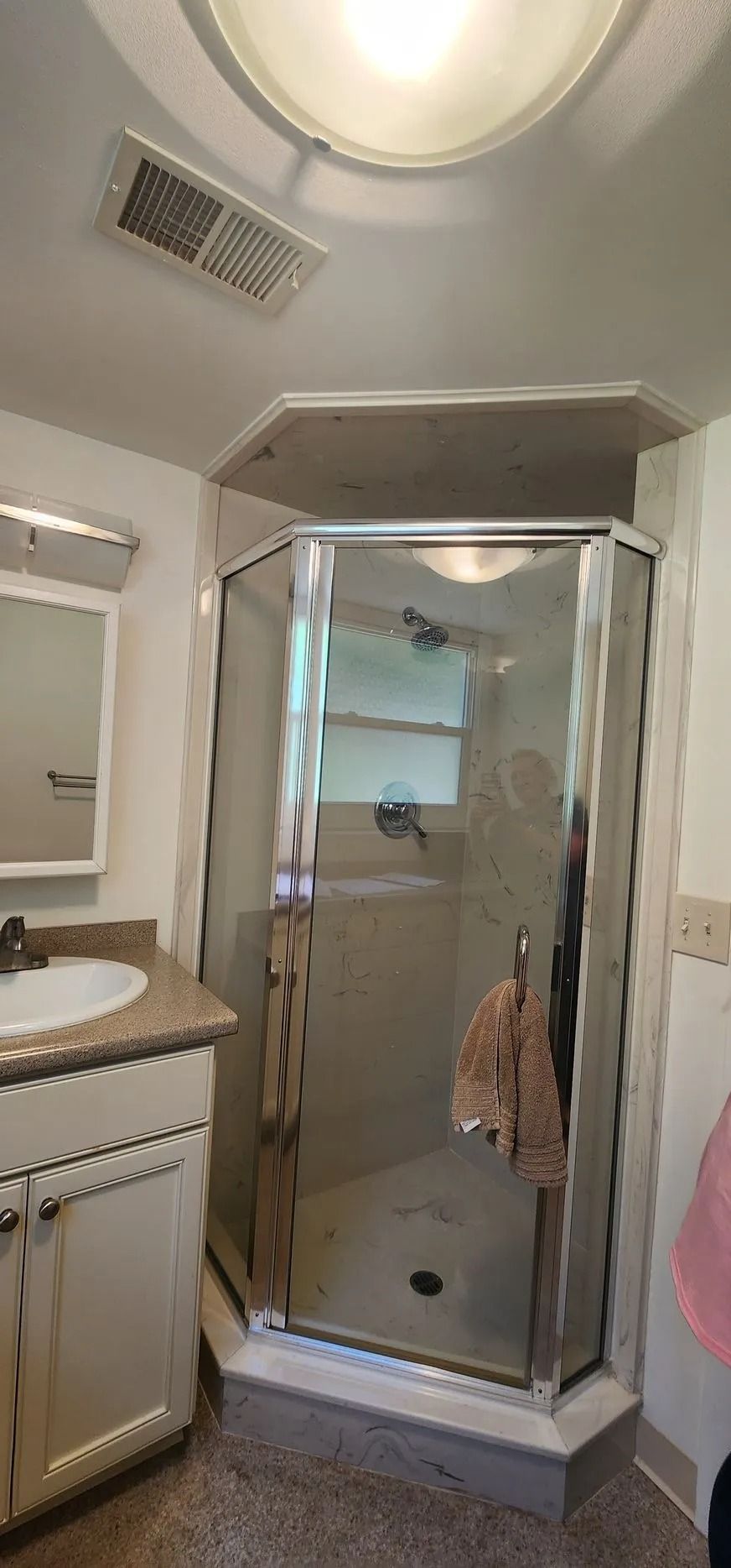 Compact bathroom with glass shower door