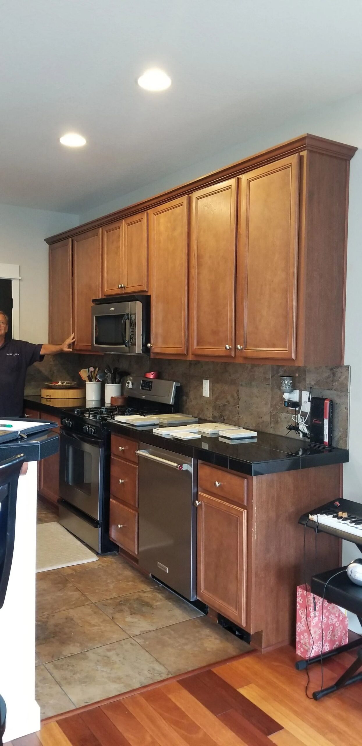 Kitchen with wooden cabinetry and appliances