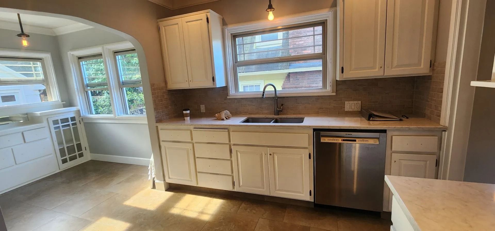 Sunlit kitchen featuring modern appliances.