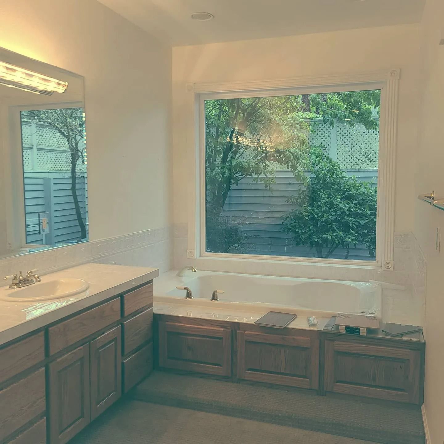 Spacious bathroom featuring wooden cabinets