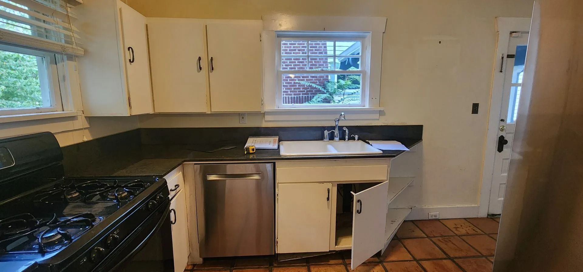 Small kitchen with white cabinets