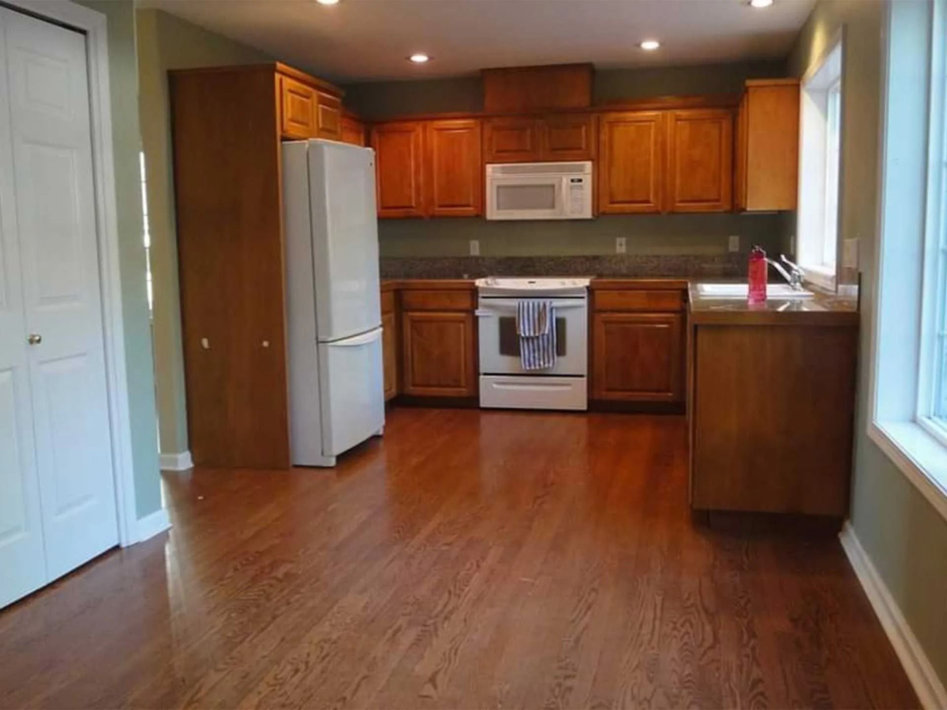Spacious kitchen with wooden cabinets