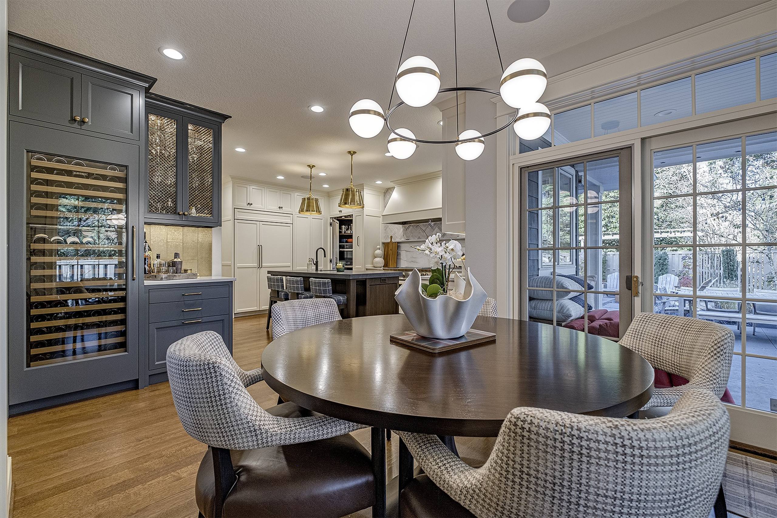Modern dining area with round table and chandelier