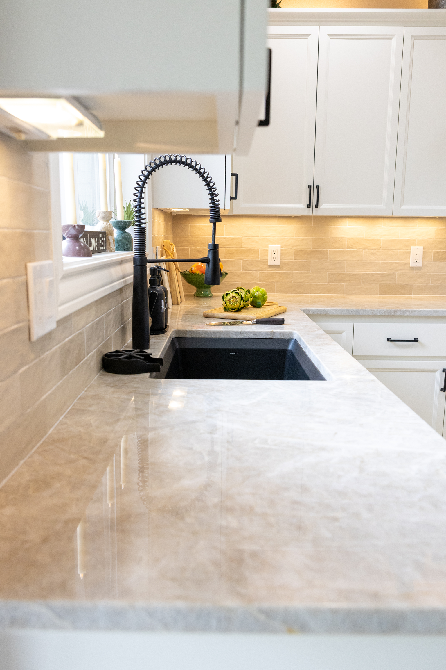 Marble countertop with black spring kitchen faucet