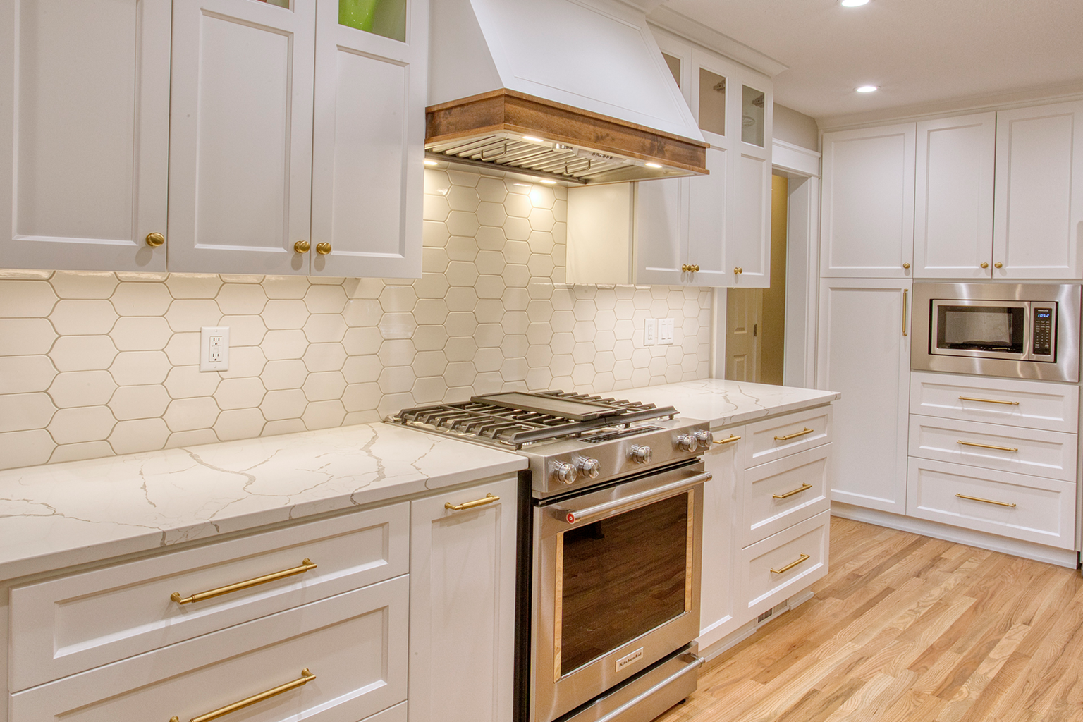 Modern white kitchen with gas range