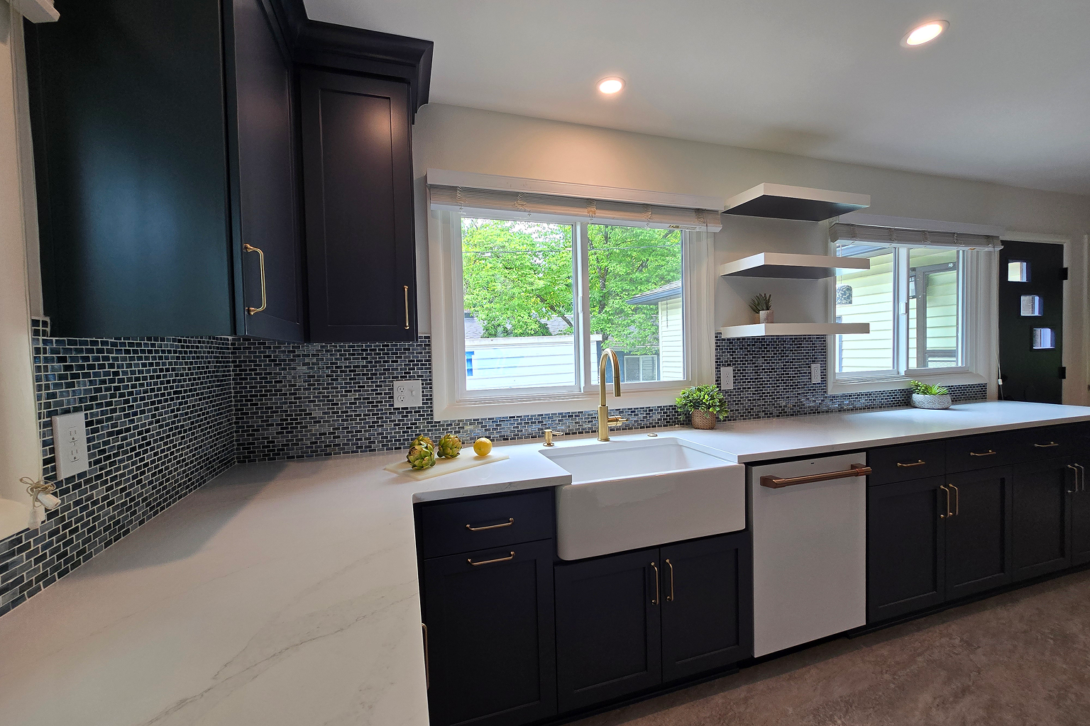 Modern kitchen with farmhouse sink and mosaic backsplash