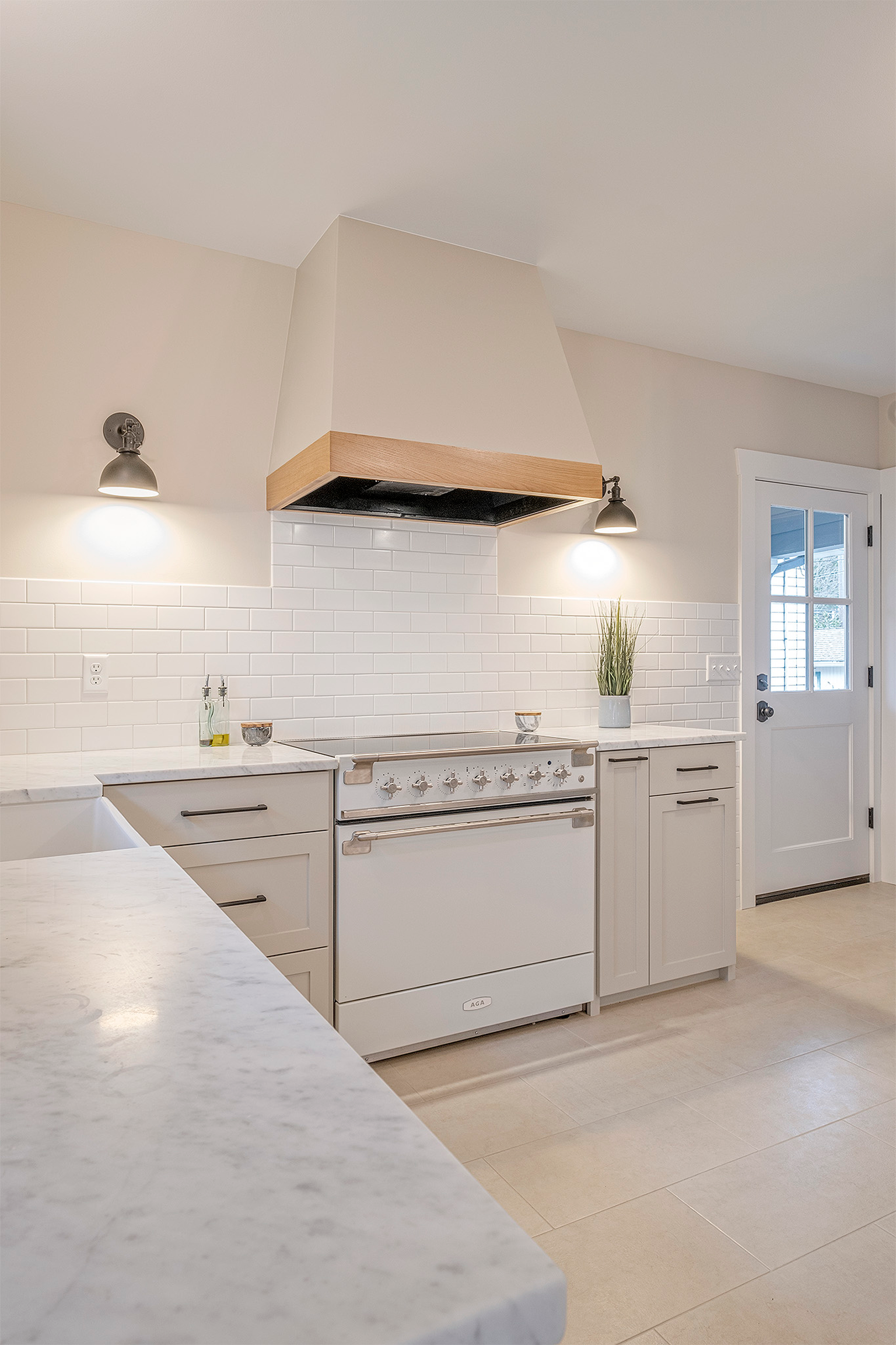 Bright modern kitchen with white range and hood