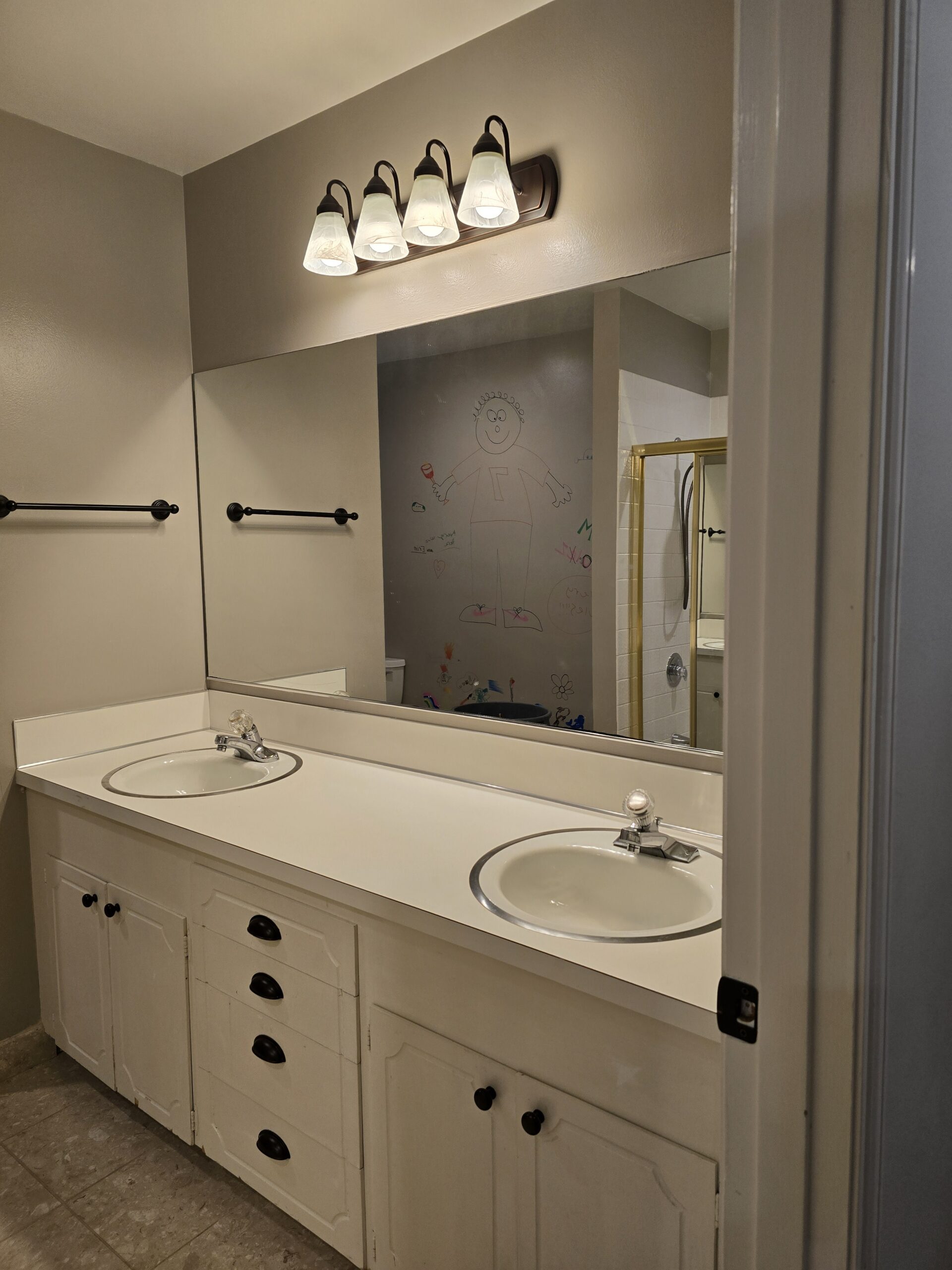 Double-sink bathroom vanity with large mirror