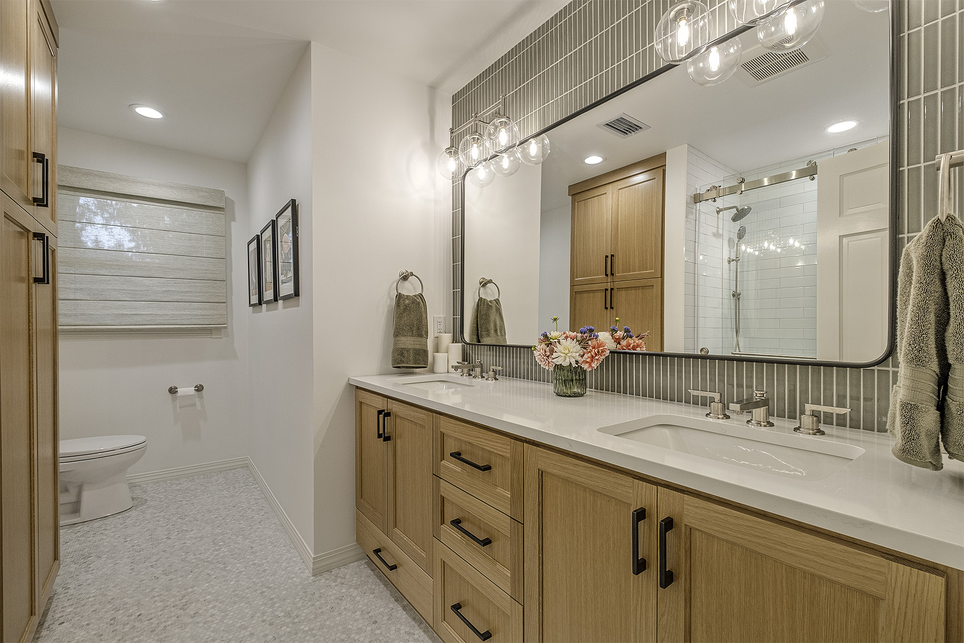 Modern bathroom with double vanity and shower