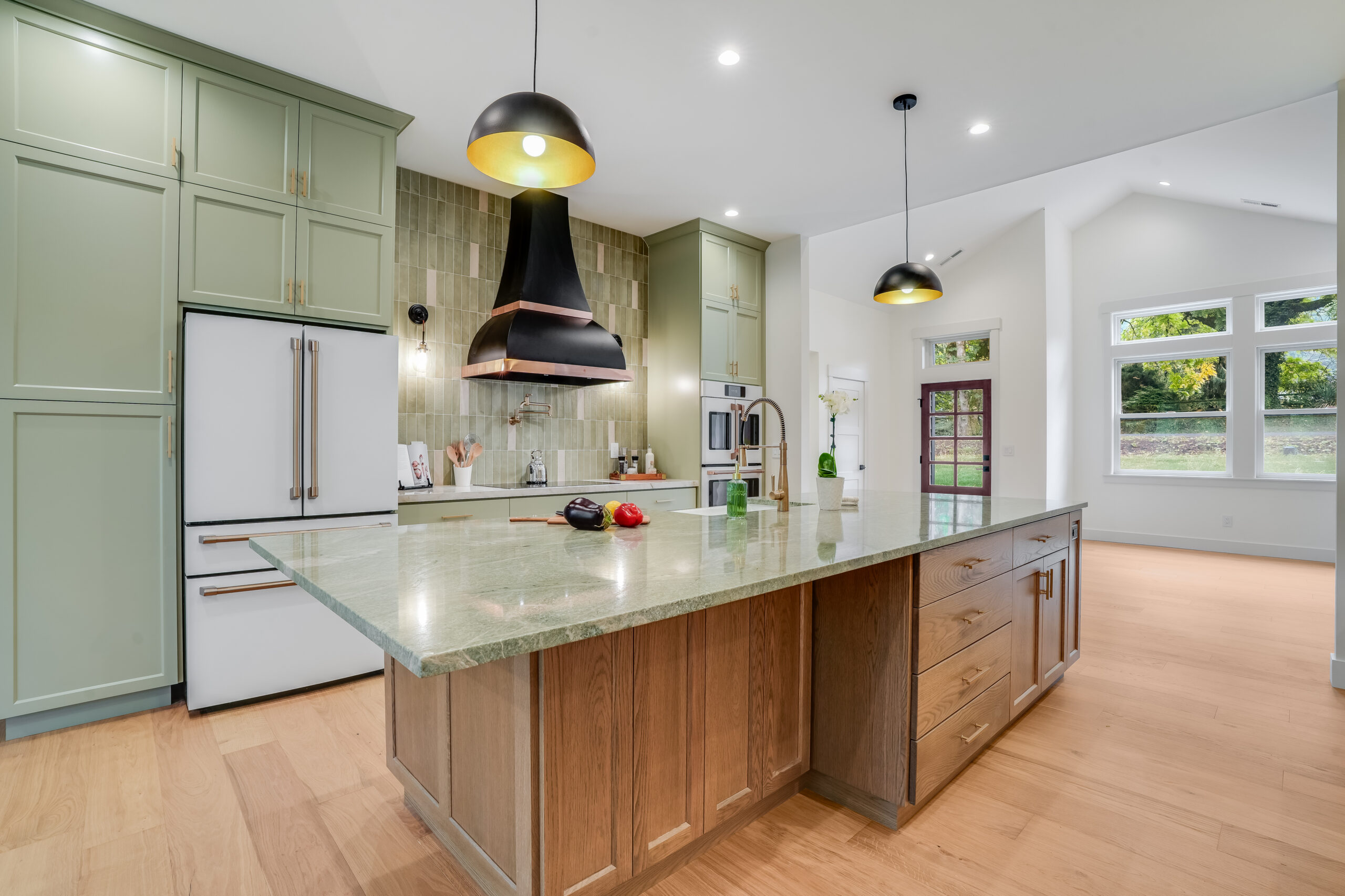 Modern kitchen with large island and pendant lights