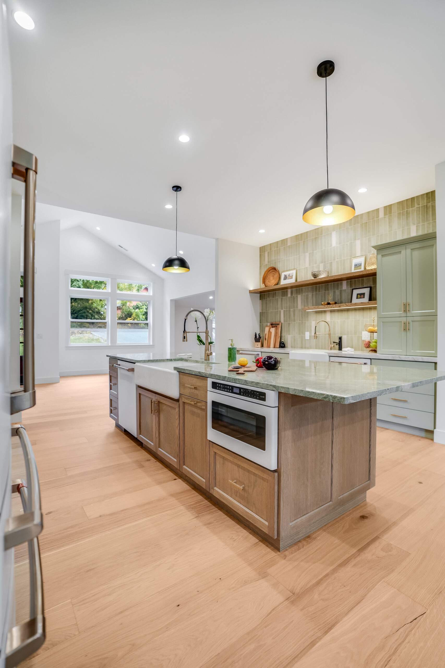 Bright modern kitchen island with pendant lights
