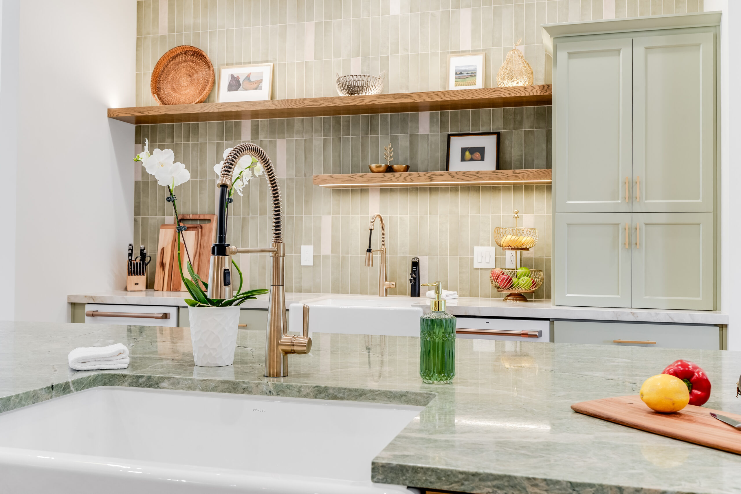 Modern kitchen island with faucet and orchid