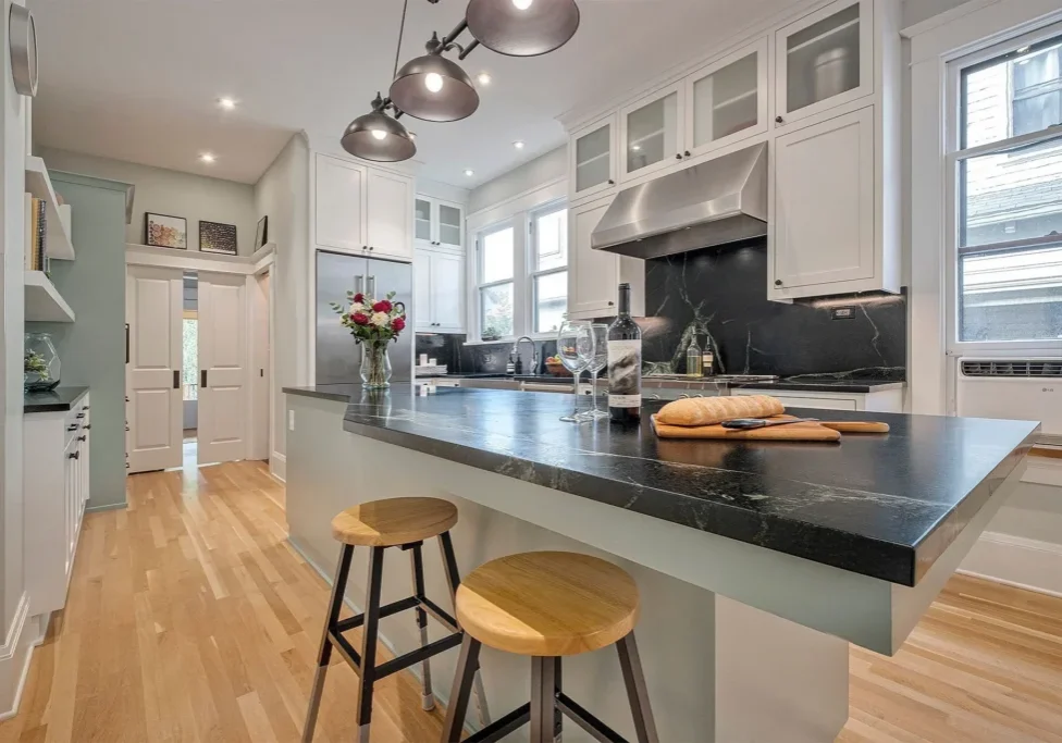 Elegant kitchen featuring wooden stools